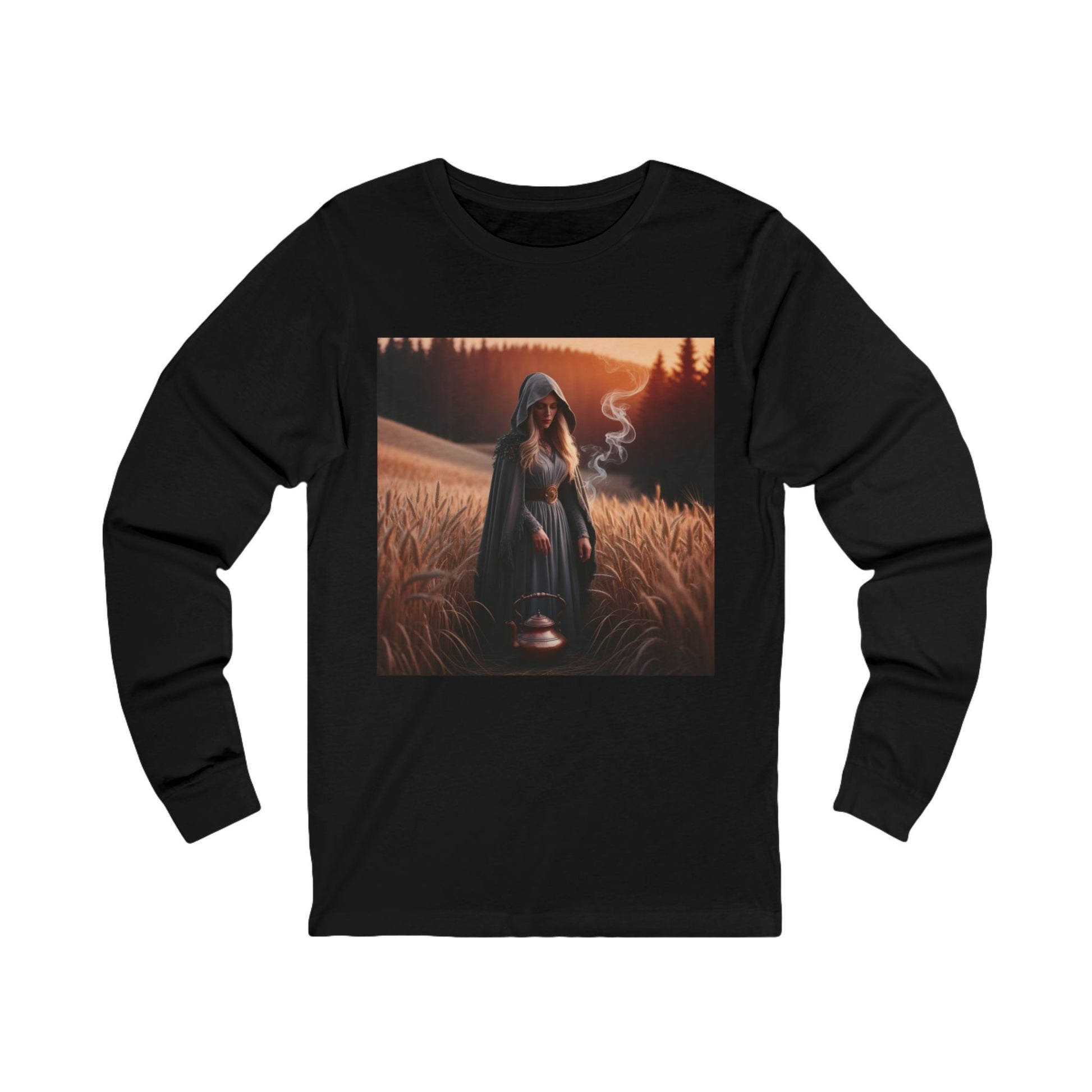 Mystical magic long sleeve tee in black featuring a hooded figure in a field at sunset.