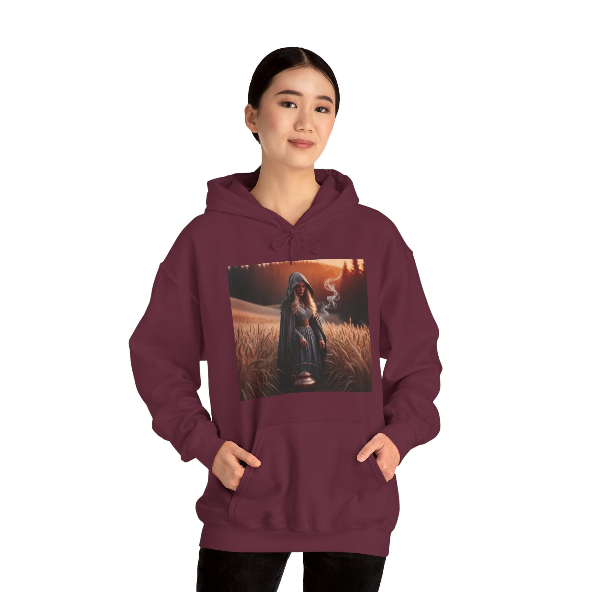 Mystical magic hoodie in maroon featuring a graphic design of a figure in a field with smoke, perfect for fall adventures.