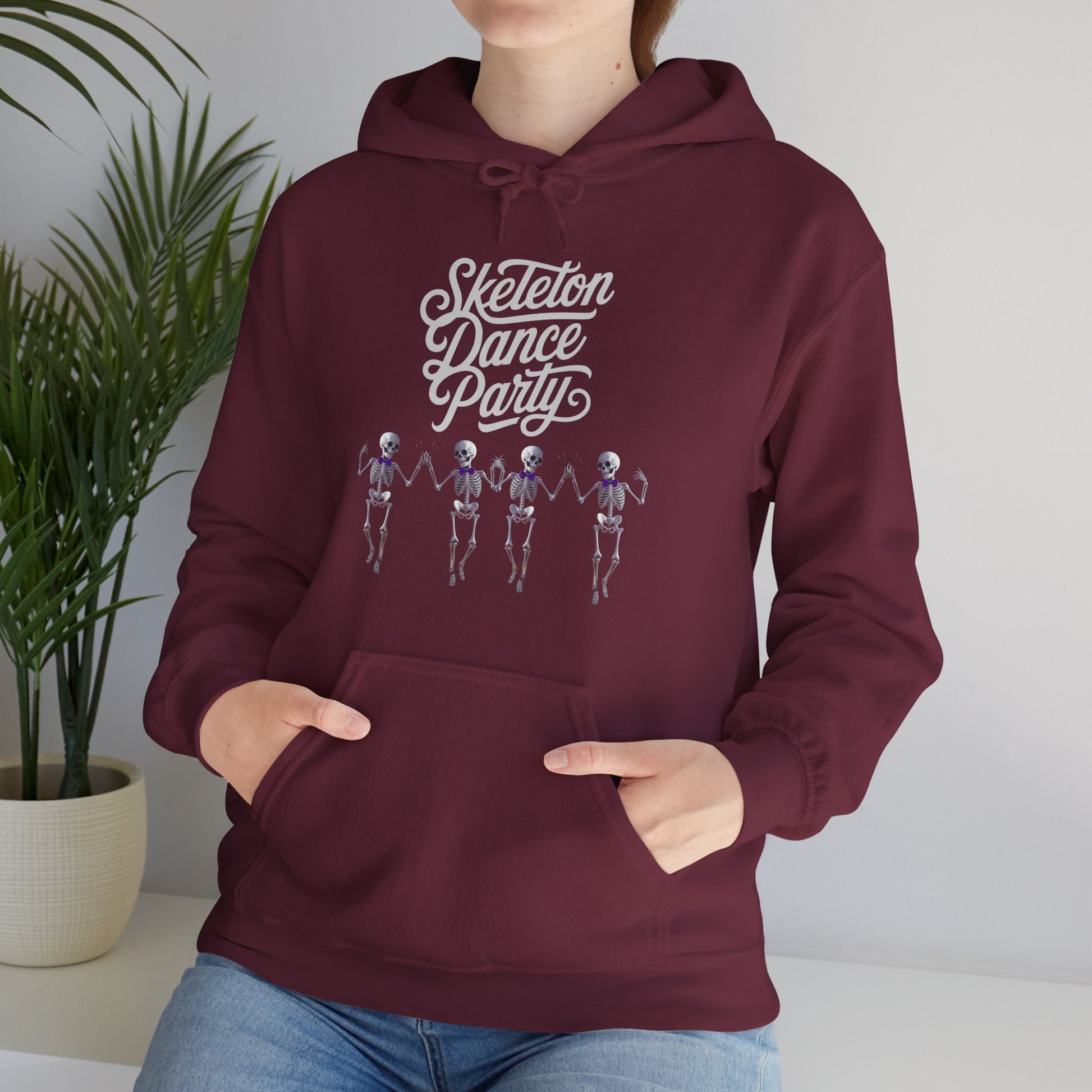 Halloween Dancing Skeleton Hoodie featuring fun skeleton graphics and cozy design for spooky celebrations with marron background mockup.